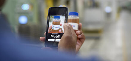 A customer using the MLA App to scan the QR code on a sample bottle