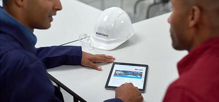 Customer with a Mobil technical expert talking though the options