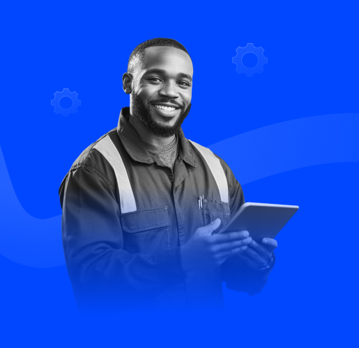 A person in a work uniform holds a tablet with both hands