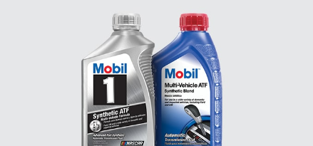 Two bottles of automatic transmission fluids standing next to each other