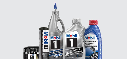 The image shows a lineup of different Mobil and Mobil 1 products. A bottle of an Oil Filter, Synthetic Grease, Gear Lubricants and Automatic Transmission Fluid