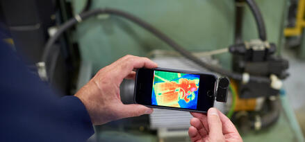 Thermal imaging inspection of industrial equipment using a smartphone.
